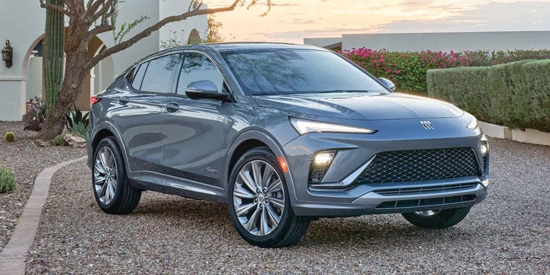 2026 Buick Envista compact SUV in gray parked on a residential driveway