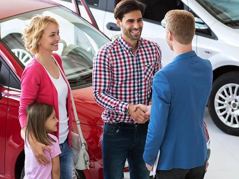 A family discussing with salesperson